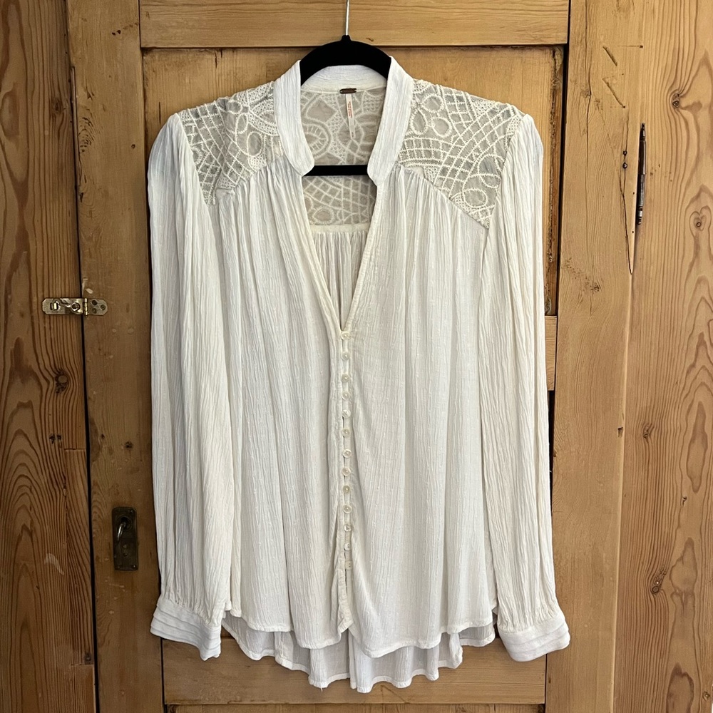Free People Blouse with crochet and gold detail.